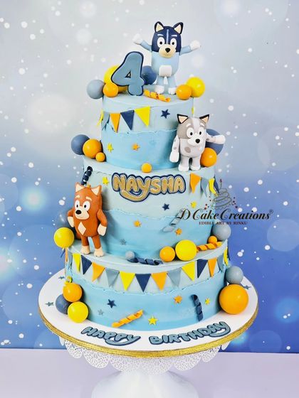 A fun, four-tier Bluey-themed cake for Naysha's 4th birthday. The cake features the beloved characters from the popular Australian cartoon.