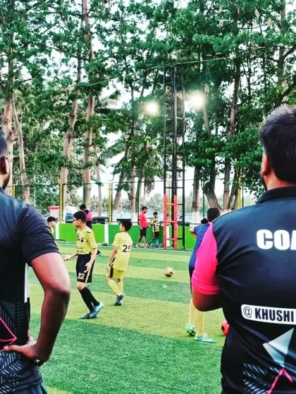 Our coaches observing a training session, always analyzing player performance to provide constructive feedback.