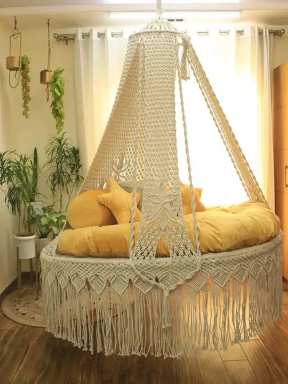 Another look at our popular bed swing design, showing the detailed fringe and the central flower knot on the canopy support.