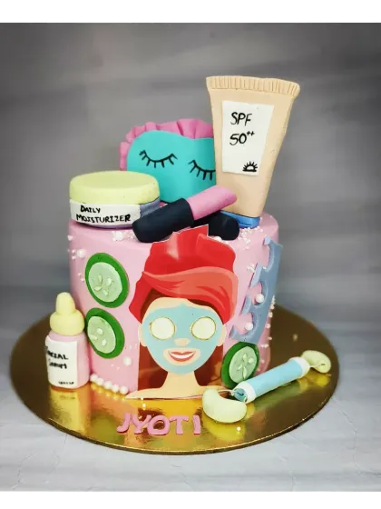 A unique "self-care" cake for a spa lover. This chocolate truffle mousse cake is decorated with handmade fondant items like face masks, moisturizers, and rollers.