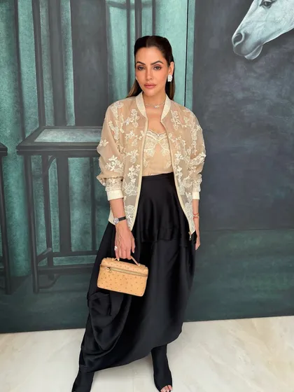 Another angle of Isha's chic and power-packed look, showing how the makeup complements her modern and sophisticated style.