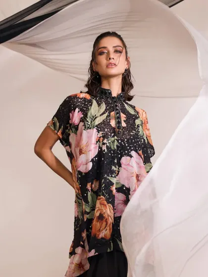 The LIANA Kurti Set, captured with flowing fabric to emphasize its glamorous and sophisticated nature.