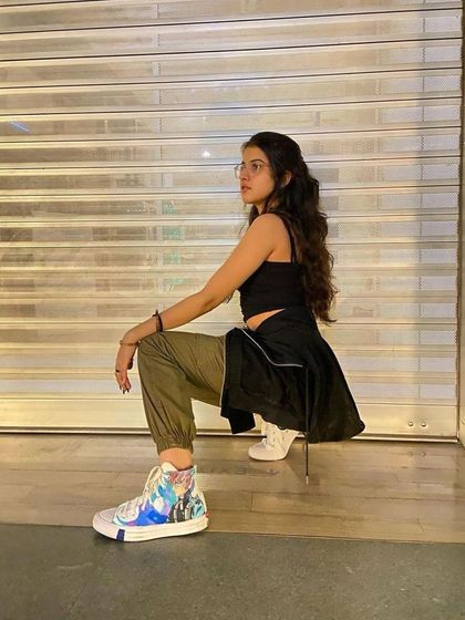 A client posing in her custom One Piece Converse at one of my live events.