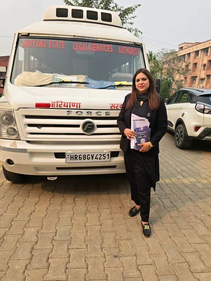 Standing by the Haryana State Legal Services Authority mobile van during a legal awareness campaign. This van allows us to reach remote areas and bring legal aid directly to the doorsteps of those who need it most.