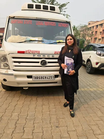 Standing by the Haryana State Legal Services Authority mobile van used for our legal awareness campaigns. We take justice on the road to reach remote and underserved communities.