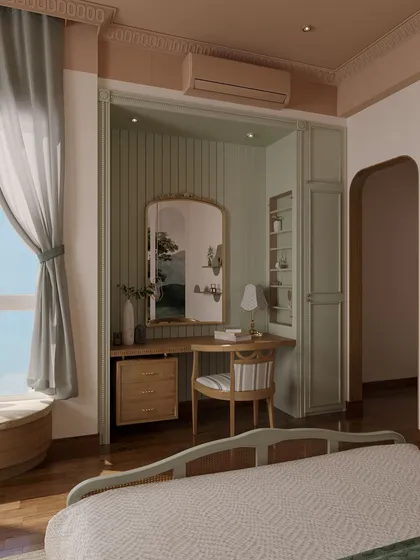 The built-in vanity nook is framed by custom cabinetry and features vertical paneling, adding texture and depth. The soft green and wood tones create a cohesive and calming atmosphere.