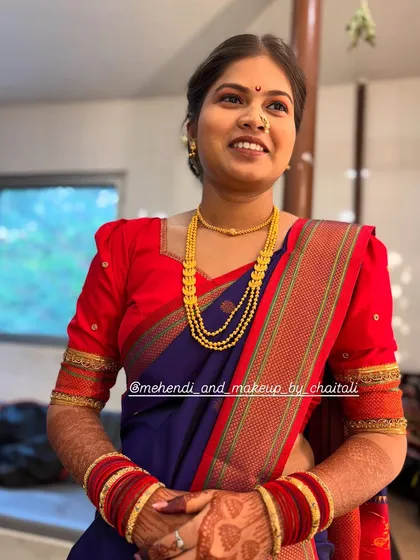 A complete traditional look for a wedding guest, featuring soft makeup, a classic bun hairstyle, and expert Nauvari saree draping. My goal is to create an elegant and comfortable look for family members.