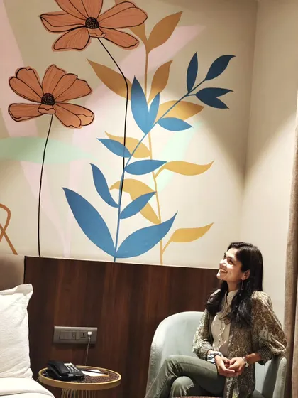 Admiring the abstract floral mural in my Udaipur hotel room, which sparked ideas for future residential projects.