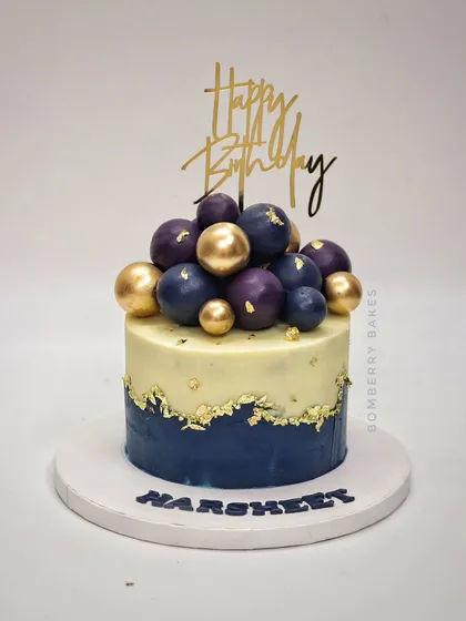 A similar design in navy blue and gold, with purple and gold spheres for a touch of royalty.
