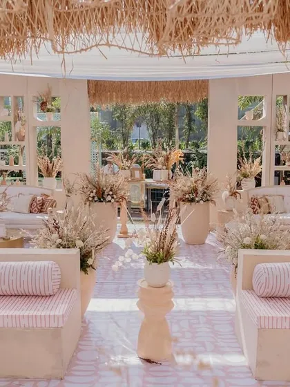 I transformed an open lawn into a complete 'Desert Oasis' for this unique Haldi ceremony. The setup featured custom-built structures, cohesive lounge seating with themed upholstery, and a color palette of earthy tones to create an immersive, elegant experience.