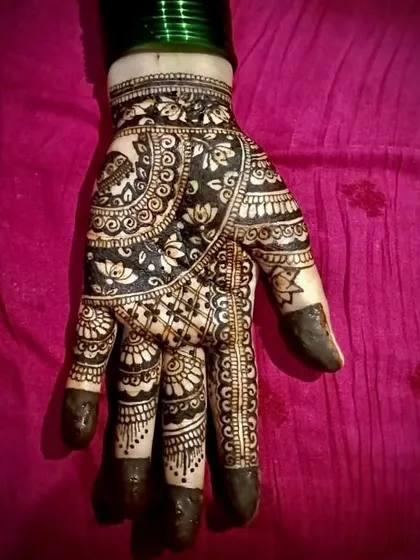 A close-up of a single hand showing intricate floral work. I used a reverse-fill technique here as well to create a bold and dramatic effect, perfect for making a statement.