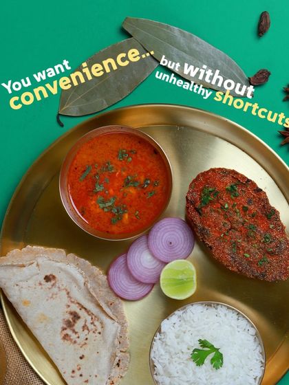 A delicious fish thali for seafood lovers. It comes with a piece of spiced fried fish, curry, rice, and roti, giving you a complete coastal meal experience.