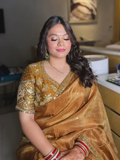 A close-up of the golden glam look, showing the shimmery eyeshadow and flawless, dewy skin.