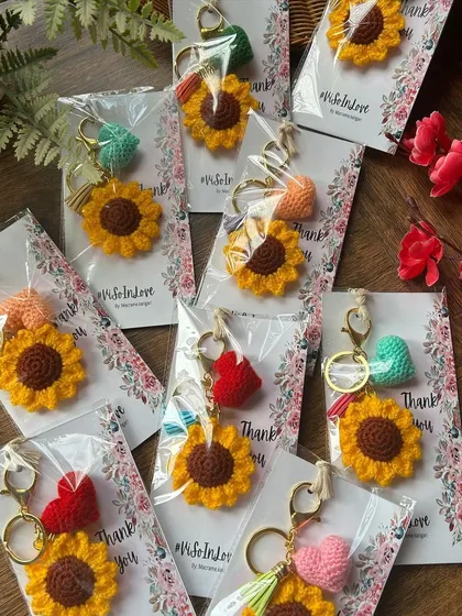 More of our sunflower keychains being prepared for a custom wedding favor order. We can add custom tags and messages for your special day.