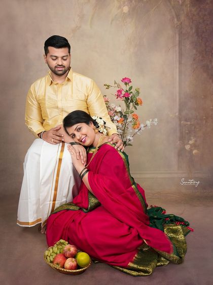 Another angle from a beautiful traditional couple session. The relaxed pose and loving expressions capture the easy chemistry and shared joy of the expecting parents.