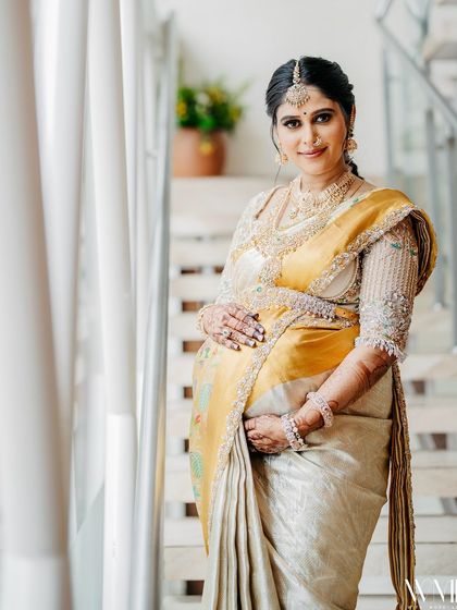 Another portrait of me cradling my baby bump, the soft light creating a serene and beautiful image.