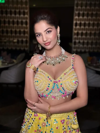 A modern take on Haldi glam. This look is all about a youthful, radiant play of color and glow, proving that pre-wedding events can be just as chic and sophisticated. Perfect for the bride who wants to shine at every celebration.