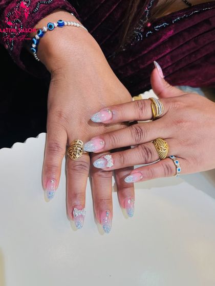 A close-up showcasing the combination of glitter, bows, and rhinestones. This is a great example of how we can layer different elements for a custom look.