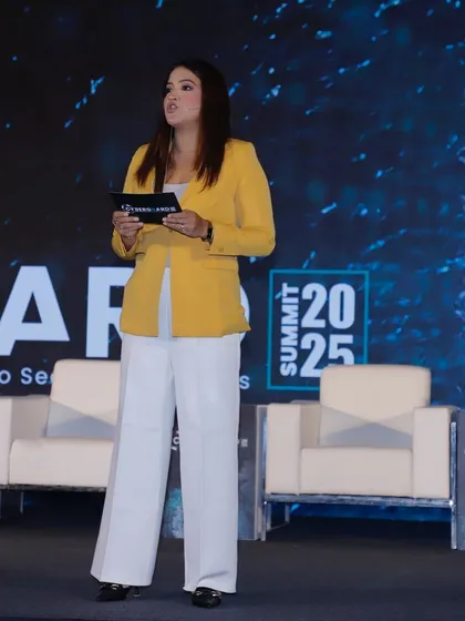 Reviewing my notes on stage at the Cyberguard Summit. I come prepared to discuss topics like data security, AI, and the future of technology, ensuring I'm a knowledgeable guide for the event.