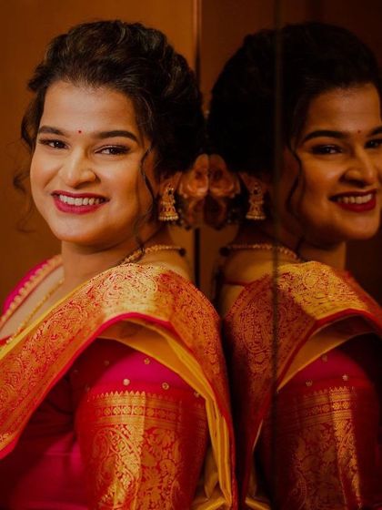 A joyful bride reflecting on her special day. This look features a bright smile, a bold lip, and a radiant complexion that looks stunning both in person and in photographs.