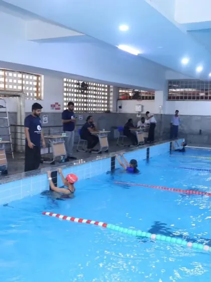 Our state-of-the-art indoor swimming pool during the 'Nautica' meet, with officials and timers ensuring a professionally conducted competition. We pride ourselves on our top-notch sports infrastructure.