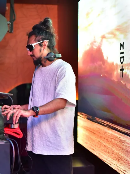 Another angle of me working the Pioneer DJ console, with the VJ screen displaying a vibrant, landscape-style visual that complements the music.