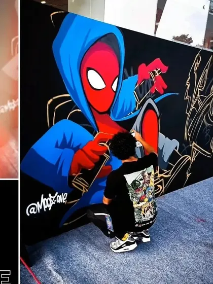 Me painting the Spider-Man and Green Goblin mural live on stage at Comic-Con. It's always a rush to paint in front of a crowd.