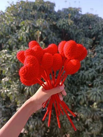 A handful of red heart-shaped flower stems.