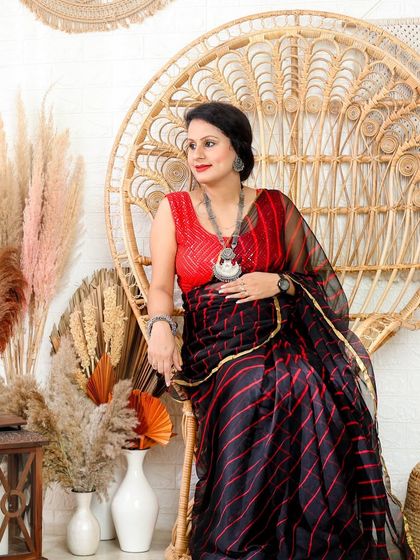 This shot shows the full look, with the modern saree set against our versatile boho studio background with pampas grass and lanterns.
