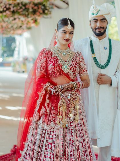 A beautiful moment between the bride and groom. Her makeup is designed to look flawless from every angle and in every light, ensuring she looks perfect in candid wedding photos.