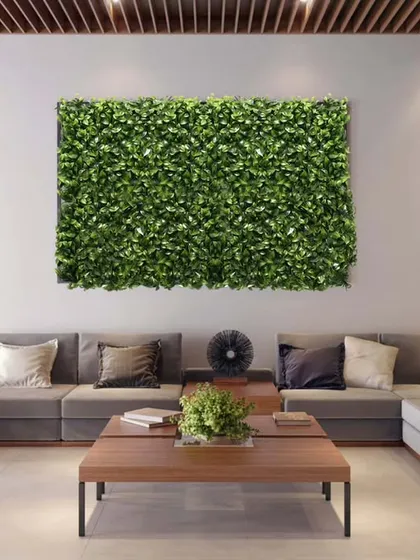 My work isn't just for outdoors. I designed and installed these elegant artificial green wall panels to bring life and a touch of nature into this modern building lobby.