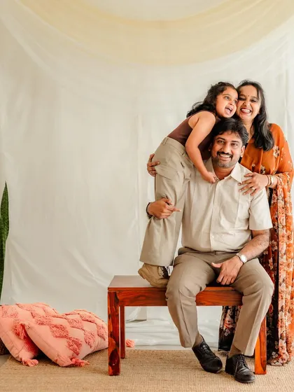 Who says studio portraits have to be stiff? In our Bangalore studio, we encourage play and laughter. This fun family pyramid is the perfect example of how we capture your family's loving and playful dynamics with a clean, classic backdrop.