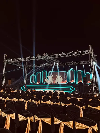 This is a stage built for performance. For this sangeet night, we constructed a large metal truss system equipped with professional spotlights and a custom LED backdrop, ready for a night of music and dance.