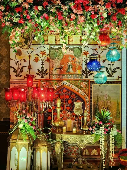 We specialize in creating rich, thematic experiences like this authentic Sufi Night setup. The decor features traditional Mughal art panels, ornate brass lanterns, and deep-hued florals to evoke a soulful and mystical ambiance for your special event.