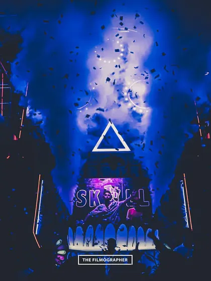 A packed club night enveloped in blue light and smoke. This image shows how I can transform any space into an immersive experience with professional lighting and atmospheric effects.