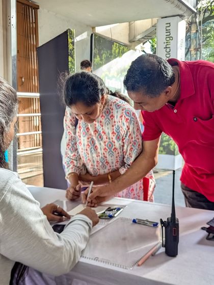 A couple signs up for more information at our Farm Expo. It's always inspiring to see people taking the first step towards their dream of owning a farm.