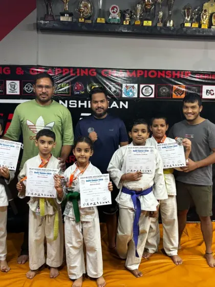 We are more than a class; we are a team. This photo captures the spirit of our dojo after a successful competition, where we celebrate every student's effort and victory together.