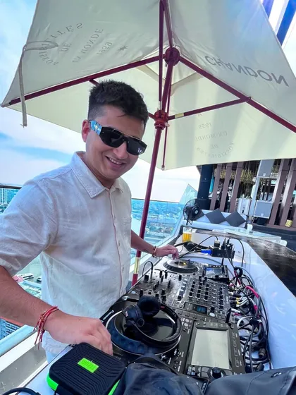 Bringing the party to a stunning rooftop in Bangkok for a destination wedding. No matter where in the world your celebration is, I bring my signature energy and a playlist to match the view.