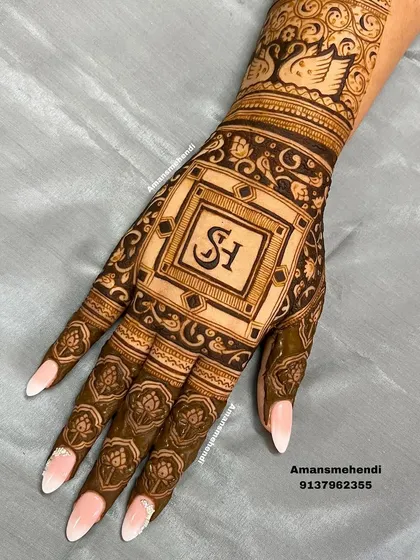 An elegant back-of-hand design with the initials "SH" in a central square frame. The surrounding patterns are delicate and intricate, creating a sophisticated look.