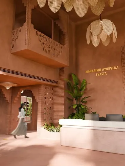 As guests move through the reception area, the terracotta walls and soft light calm the senses. Every detail is designed to ground the spirit and welcome guests home.