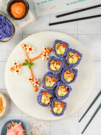 Purple rice sushi arranged in a floral pattern. This creative plating and styling shows how I can turn food into a work of art, perfect for a unique menu.