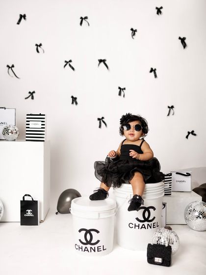 The little sister is a fashion icon in the making. Posing with tiny sunglasses, she looks absolutely adorable in this high-fashion themed shoot.
