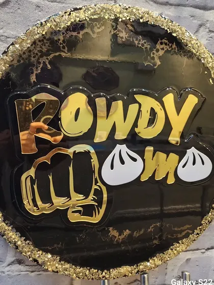 A custom logo nameplate I made for a client's business, "Rowdy Momo". The bold gold lettering and fun design really stand out.