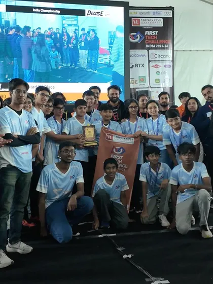 Team FTC Sigma 20890 proudly displays their 3rd place Reach Award. This award recognizes their effort in connecting with the community and sharing their passion for STEM beyond the competition field.