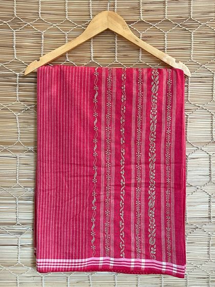 This vibrant pink handloom saree is adorned with intricate Chikankari embroidery. Each piece is crafted by skilled artisans, making it a unique addition to your wardrobe.