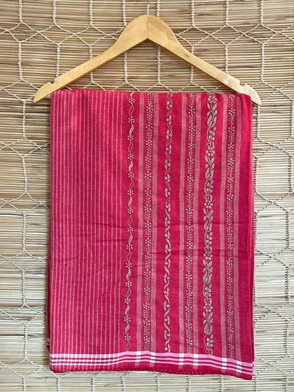 This vibrant pink handloom saree is adorned with intricate Chikankari embroidery. Each piece is crafted by skilled artisans, making it a unique addition to your wardrobe.