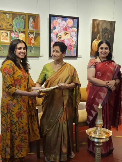 Receiving a certificate of participation at an exhibition. It's a proud moment to be recognized for my work alongside other talented artists.