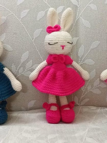 A trio of bunny dolls, each in a different colored dress with matching shoes. You can order a whole wardrobe for them.