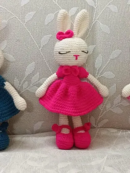 A front view of the three colorful bunny dolls, each with matching shoes and a bow, showcasing the customization options available.