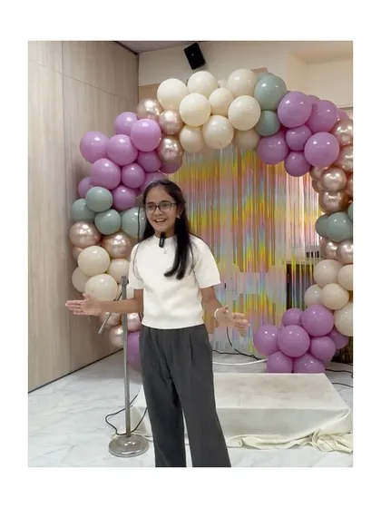 With open arms and a welcoming smile, this speaker connects with her audience during the parent presentation.